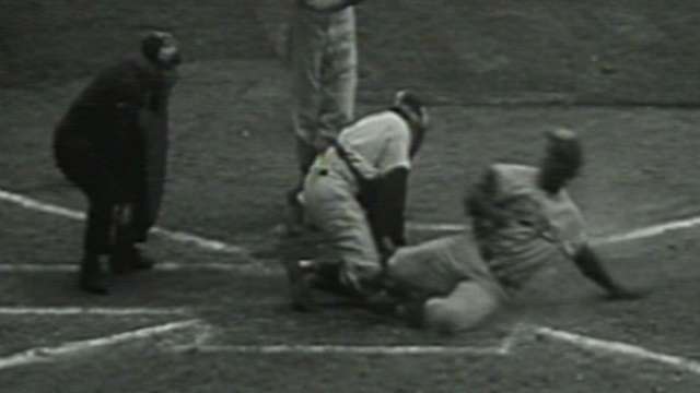 Jackie robinson stealing home Yogi Berra Catcher in 1st game 1955